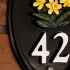 Aluminium Vertical Oval House Number - 19 x 14cm with motif